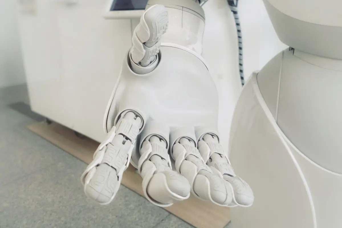 A white robot hand reaching out