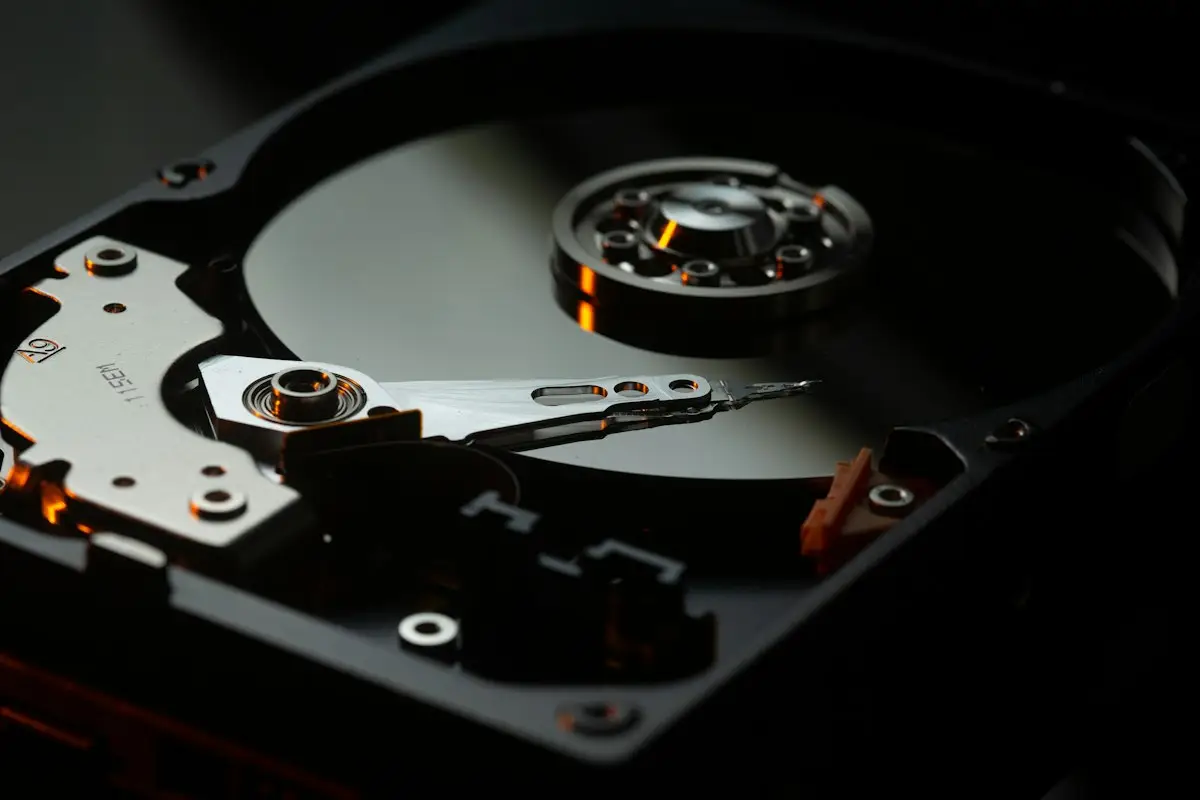 An opened hard drive showing the platter