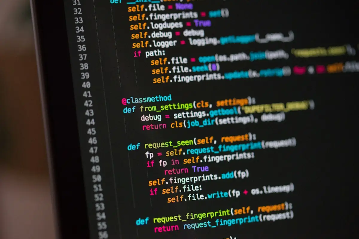 Close-up of program code on a dark screen