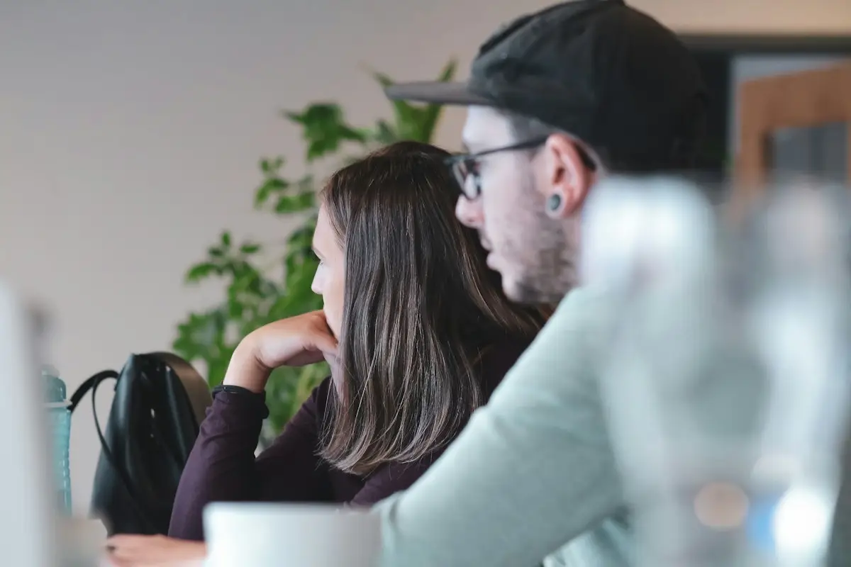 Two people looking at a laptop together